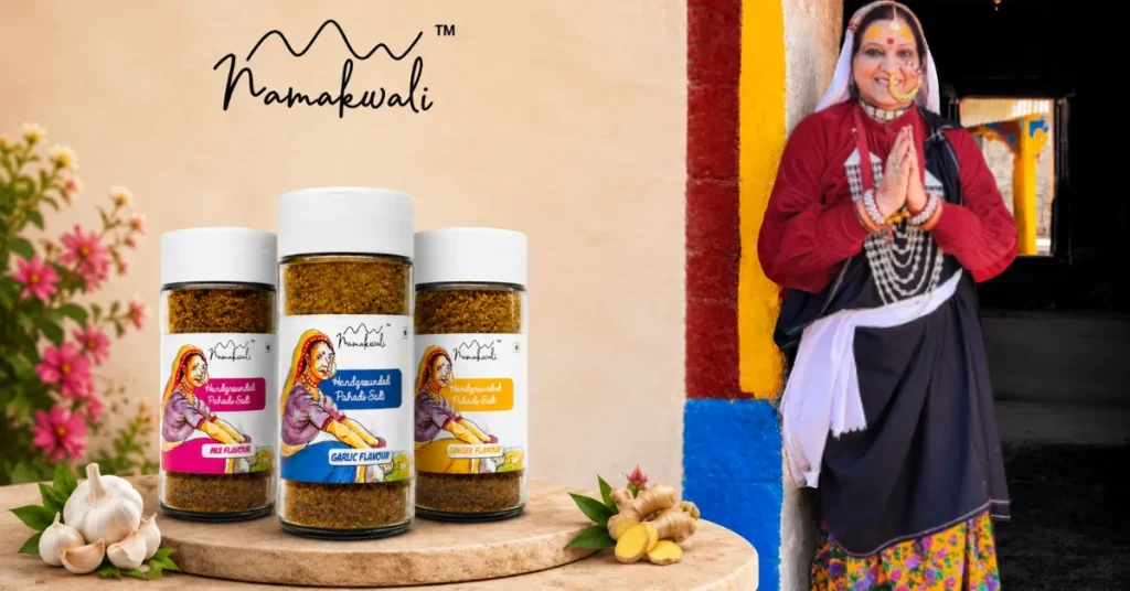 Namakwali founder Shashi Ratudi standing beside packaged traditional Pahadi salt products.
