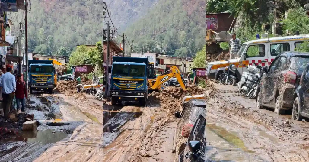 Mud and debris spread across Narayanbagad market in Chamoli district after heavy rainfall, with vehicles and earthmoving machinery visible during cleanup operations.