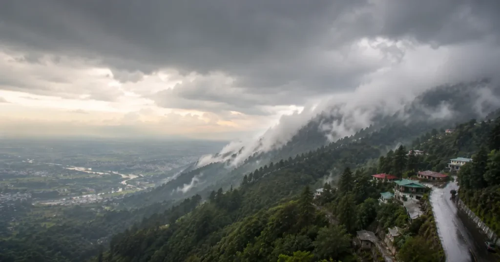 Dark rain clouds and mist covering the hills of Uttarakhand during changing weather conditions.
