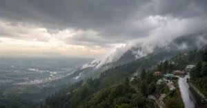 Dark rain clouds and mist covering the hills of Uttarakhand during changing weather conditions.
