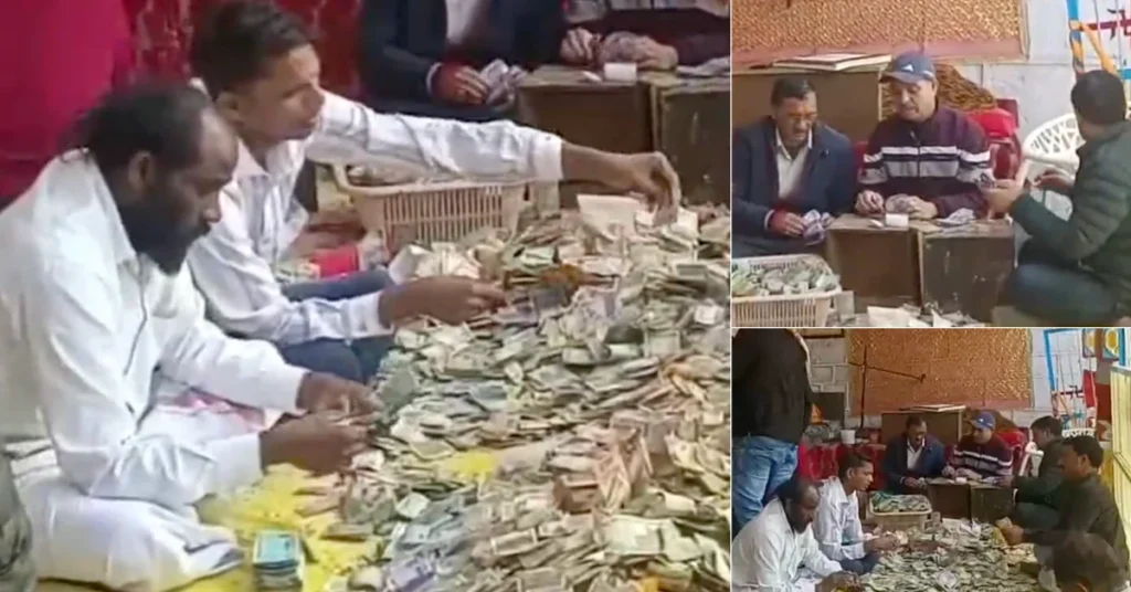 Officials and staff counting cash offerings during the donation counting process at Badrinath Temple in a screengrab from an ANI video.
