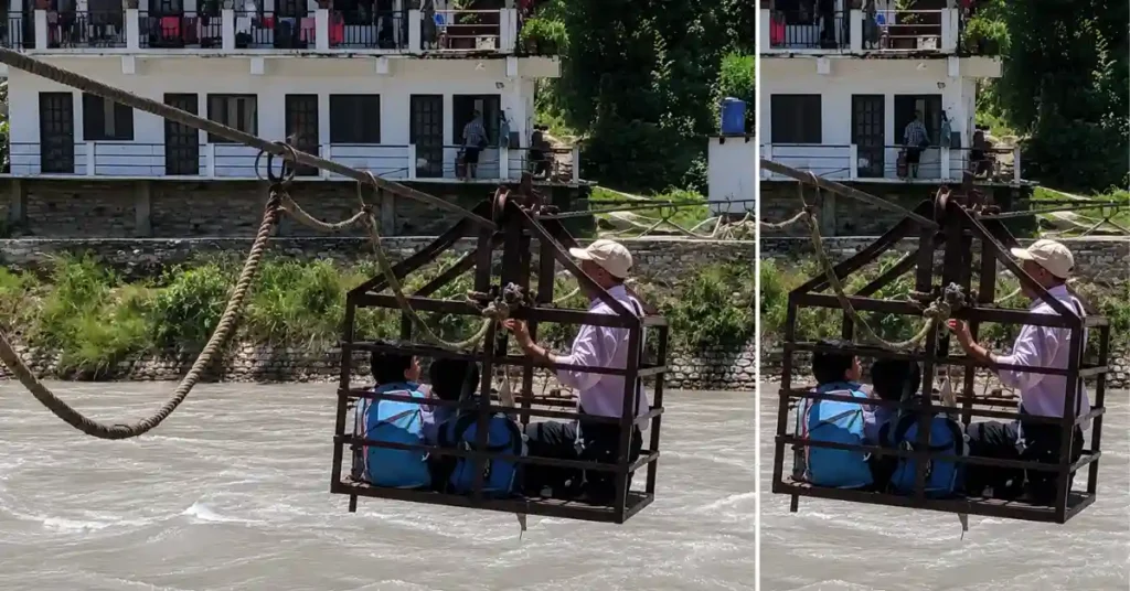 Schoolchildren and a guardian crossing the Ramganga River in a manually operated trolley after the bridge was washed away in Bageshwar.
