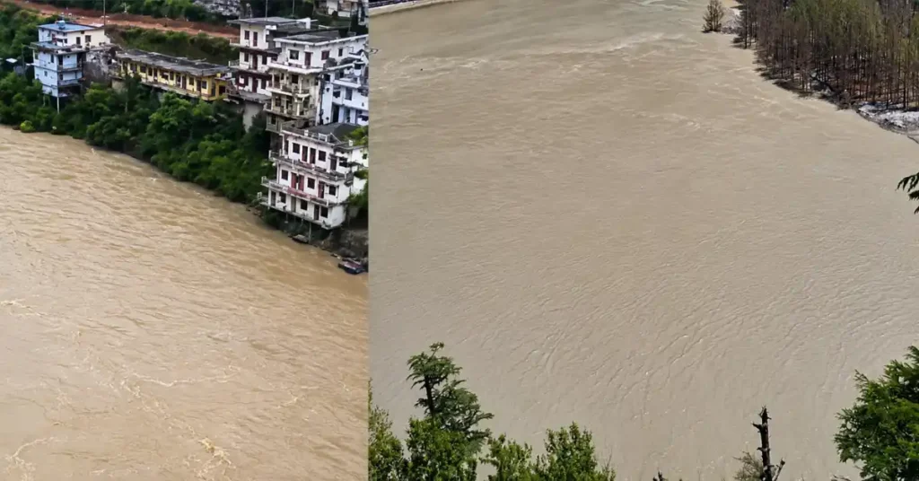 The swollen Bhagirathi River flowing close to riverside buildings in Harsil amid heavy monsoon conditions in Uttarkashi.