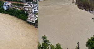The swollen Bhagirathi River flowing close to riverside buildings in Harsil amid heavy monsoon conditions in Uttarkashi.