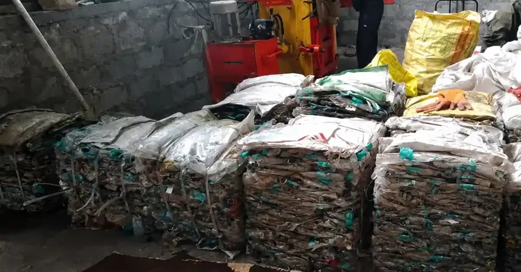 Compressed bales of collected plastic waste stored at a material recovery facility under the Digital Deposit Refund System in Uttarakhand.