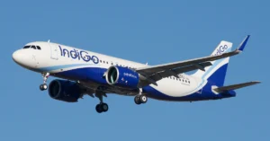 Passenger aircraft flying over mountainous terrain representing the new direct air service between Noida and Dehradun.