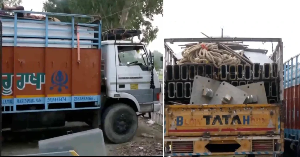Trucks carrying stage and event materials parked outside Parade Ground in Dehradun ahead of Rahul Gandhi's scheduled programme.