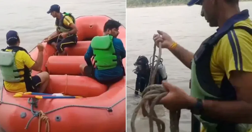 SDRF rescue personnel conduct a search operation in the Ganga River at Rishikesh using an inflatable rescue boat and diving equipment.
