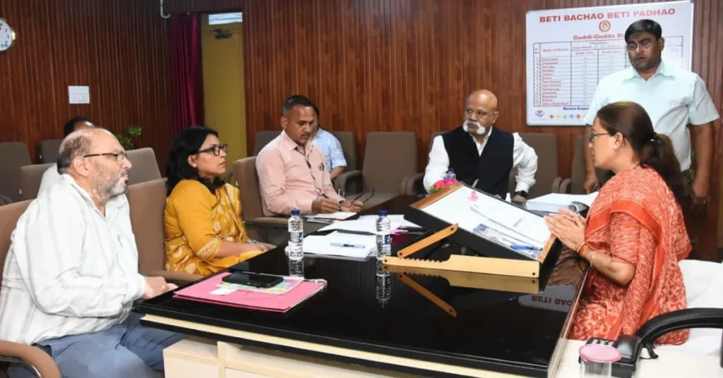 Sports Minister Rekha Arya chairs a review meeting with departmental officials on Uttarakhand's new sports policy at the camp office in Dehradun.