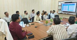 Officials reviewing the progress of PM Awas Yojana Urban housing projects during a meeting in Dehradun, Uttarakhand.
