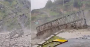 Valley bridge damaged by a strong water flow in Chamoli's Niti Valley.