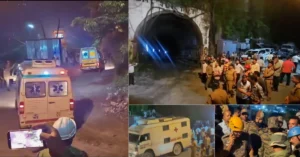 Rescue teams, ambulances and security personnel outside the tunnel during the Chamoli accident response.