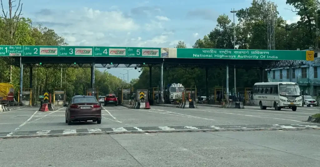 Vehicles passing through electronic toll collection lanes at an NHAI toll plaza