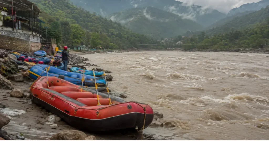 Rafting boats waiting on the Ganga riverbank in Rishikesh during high water levels