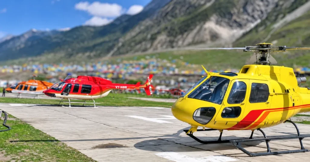 Helicopters parked at a mountain helipad in Kedarnath amid preparations for helicopter service